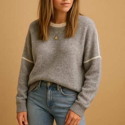 Women’s knit sweater with round neckline, long sleeves, and a wrinkle-resistant finish—perfect for stylish comfort in cool weather.