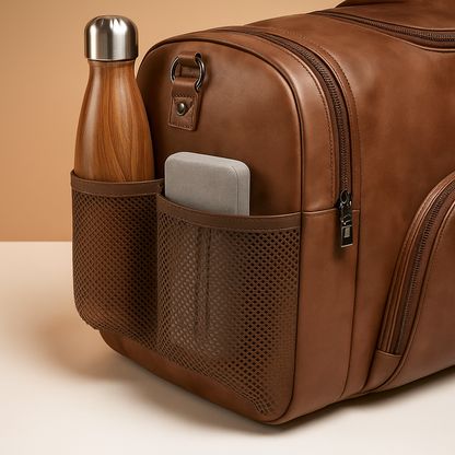Men’s leather travel duffle bag with separate shoe compartment, multiple zip pockets, and TSA-compliant size for stylish and organised travel.