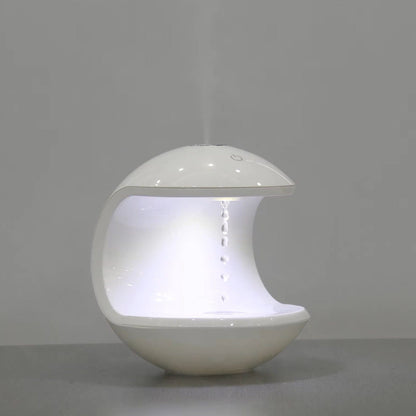 "Levitating Water Droplet Ultrasonic Humidifier with LED light, showing floating droplets effect, perfect for modern decor."