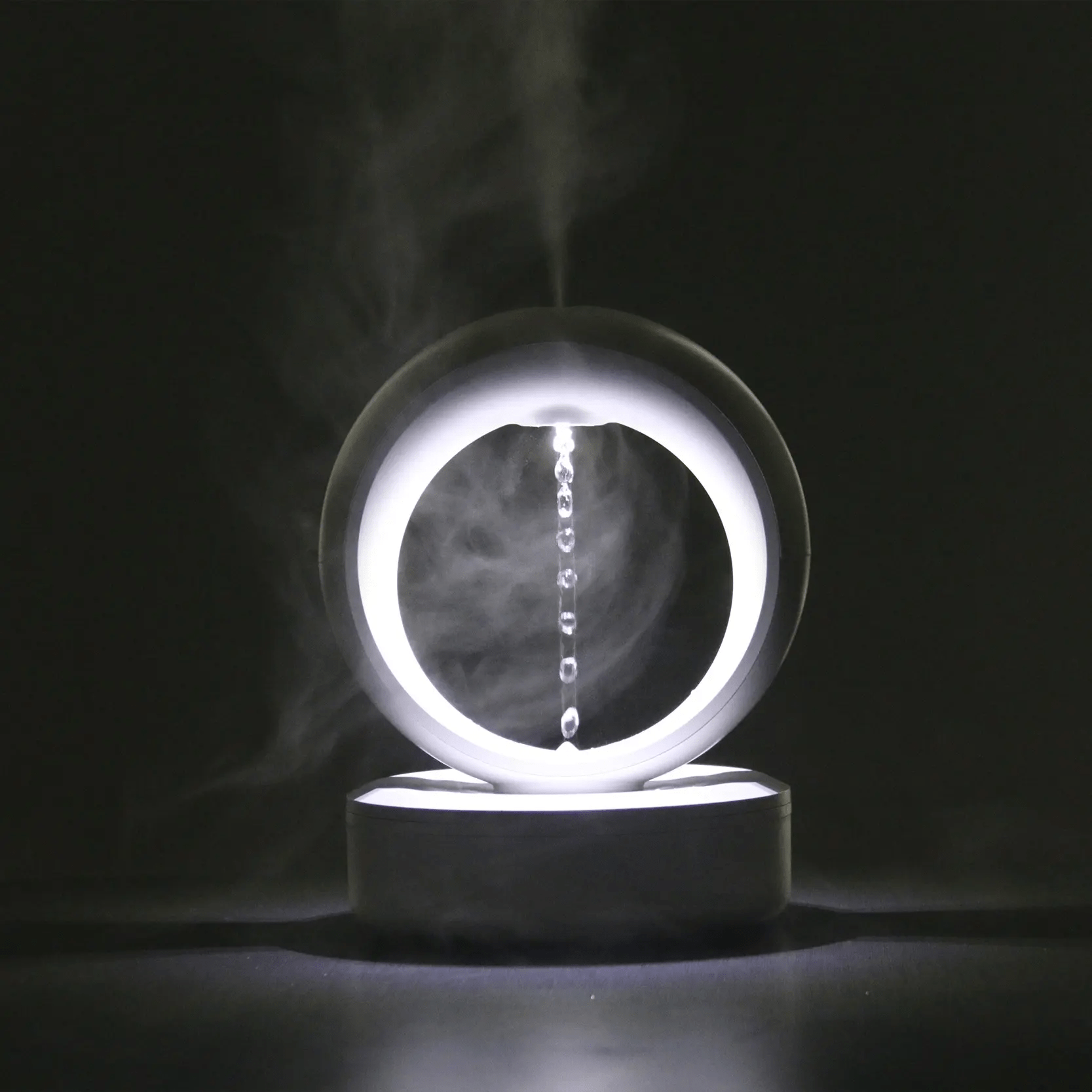 "Levitating Water Droplet Ultrasonic Humidifier with LED light, showing floating droplets effect, perfect for modern decor."
