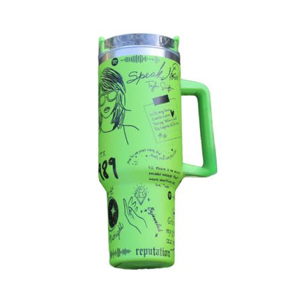 "Limited edition stainless steel tumbler with custom design, handwritten lyrics, vibrant colors, and ergonomic handle."