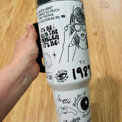 "Limited edition stainless steel tumbler with custom design, handwritten lyrics, vibrant colors, and ergonomic handle."