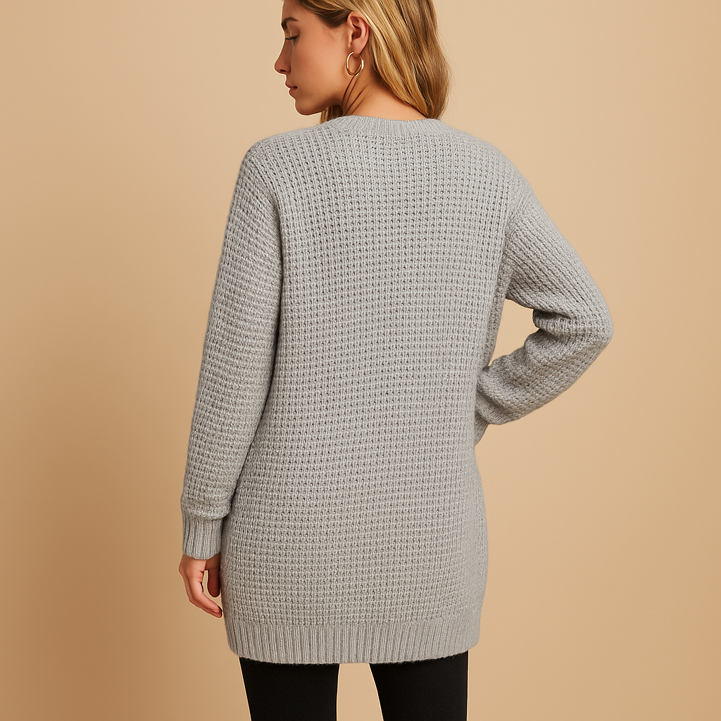 Women’s long cardigan with V-neck and front pockets, available in solid colors like grey and pink—perfect for layering in fall and winter.