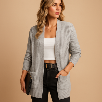 Women’s long cardigan with V-neck and front pockets, available in solid colors like grey and pink—perfect for layering in fall and winter.