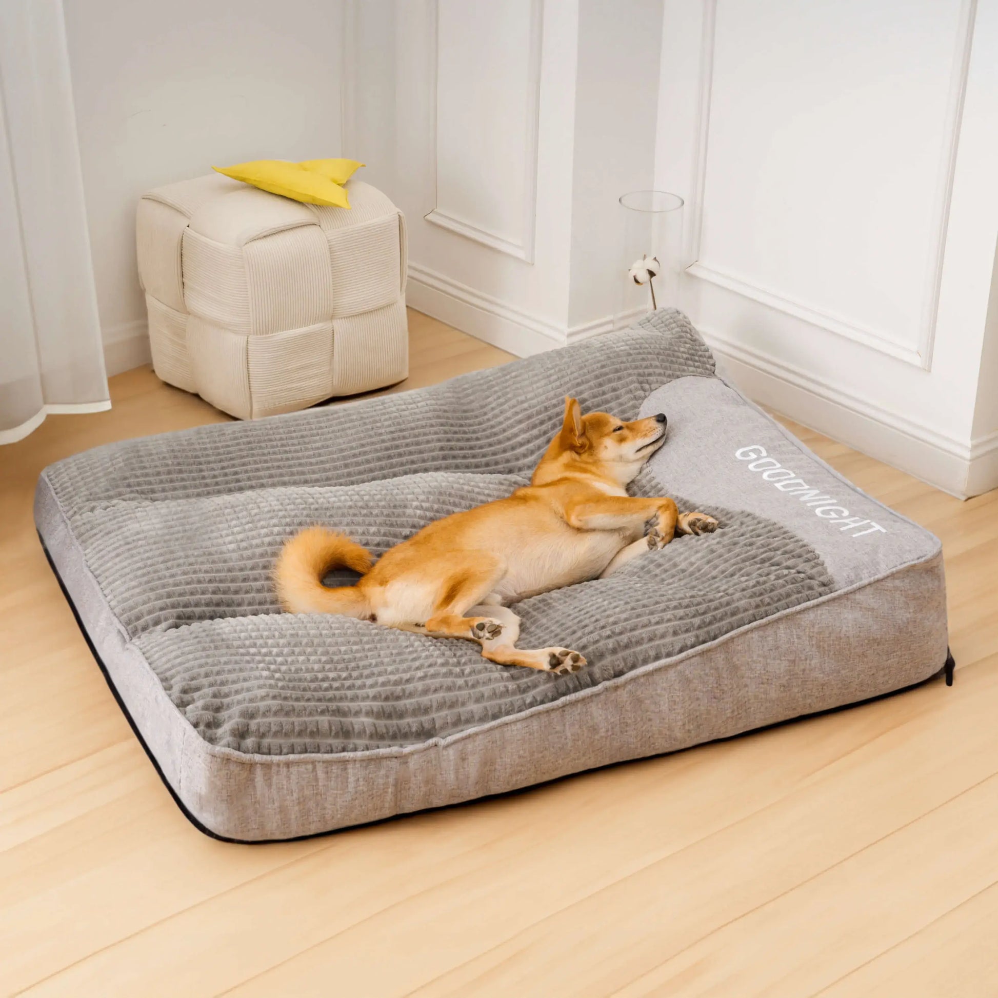 "Luxurious calming washable dog cushion in soft faux fur, available in sizes for all dogs, promotes stress-free relaxation."