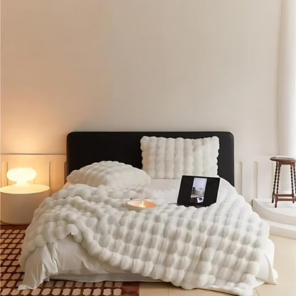 "Luxurious double-sided fleece and faux fur blanket for ultimate warmth, soft texture; ideal bedding or decorative throw."