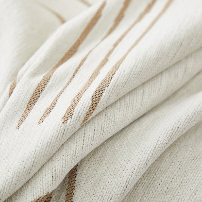 Luxurious sofa throw cover for sectionals, elegantly draped in soft, stretchable fabric, ideal for modern home decor.