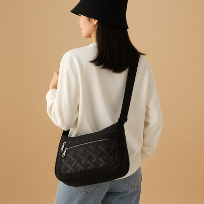 Luxury anti-theft messenger bag for women with zippered compartments and hidden pocket, perfect for travel and everyday use.