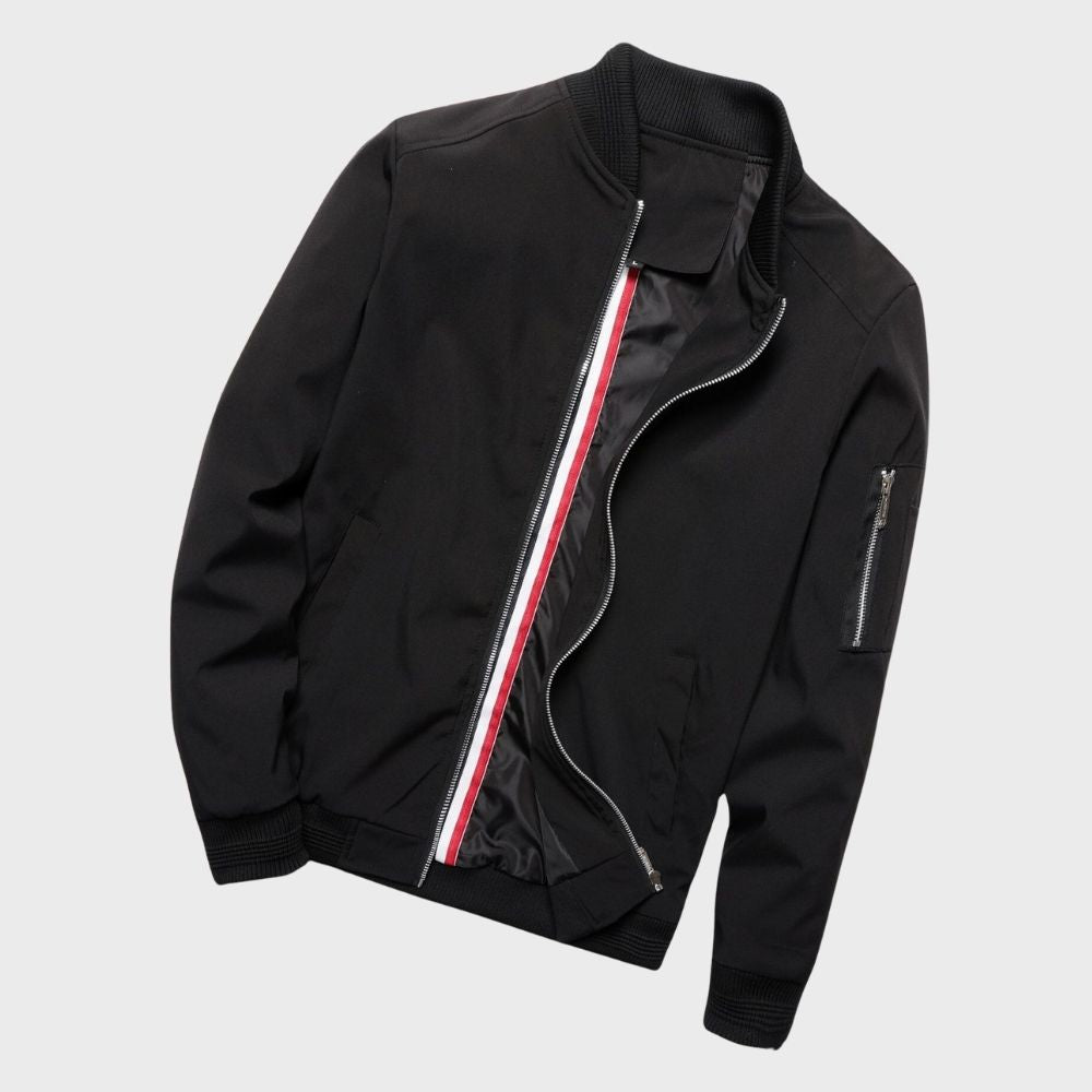 "Men's blue bomber jacket with zipper pockets, stylish fit, lightweight fabric, perfect for cool evenings."