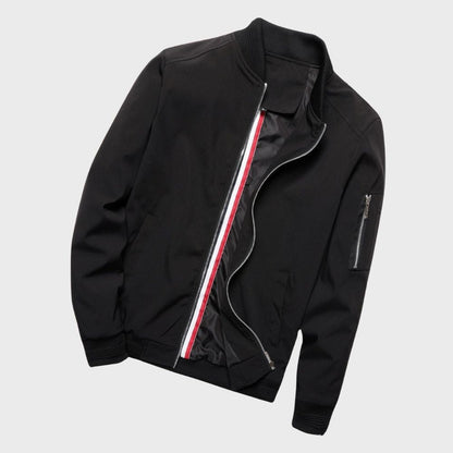 "Men's blue bomber jacket with zipper pockets, stylish fit, lightweight fabric, perfect for cool evenings."