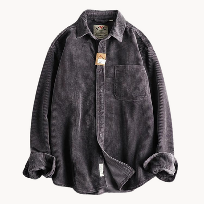 Men's classic orange corduroy shirt with button-down front and textured fabric, ideal for layering and timeless style.
