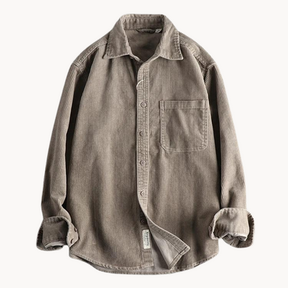 Men's classic orange corduroy shirt with button-down front and textured fabric, ideal for layering and timeless style.