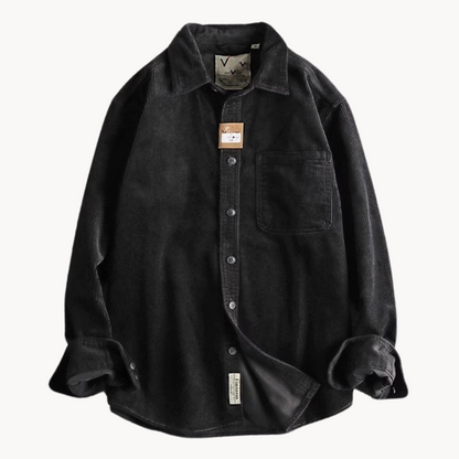 Men's classic orange corduroy shirt with button-down front and textured fabric, ideal for layering and timeless style.