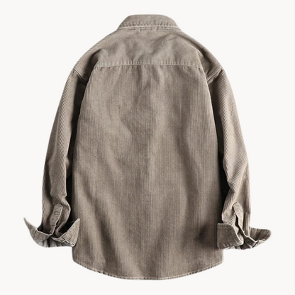 Men's classic orange corduroy shirt with button-down front and textured fabric, ideal for layering and timeless style.