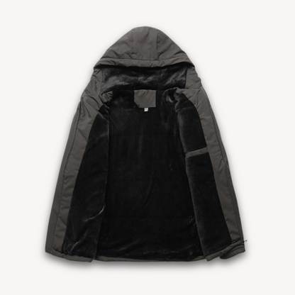 "Men's green waterproof hooded jacket for stylish and durable outerwear. Features sleek design and multi-pocket functionality