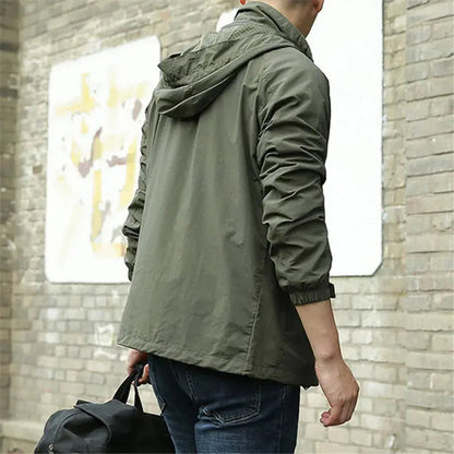 Men's lightweight breathable all-season jacket, sleek design, dark color, highlighting its comfort and versatility for layeri
