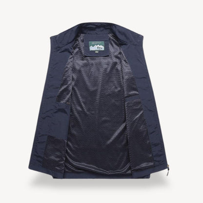 Men's lightweight quilted vest, stylish layering in navy blue, full zip, insulated yet non-bulky, perfect for cooler seasons.