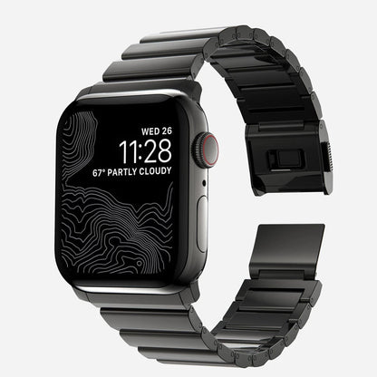 Men's sleek titanium watch band with shiny finish, magnetic clasp, durable and lightweight; perfect for daily or formal wear.