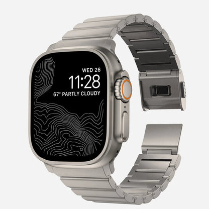 Men's sleek titanium watch band with shiny finish, magnetic clasp, durable and lightweight; perfect for daily or formal wear.