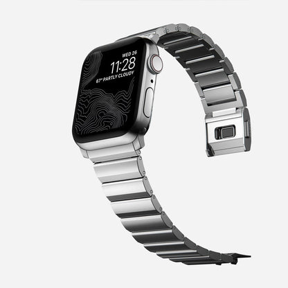 Men's sleek titanium watch band with shiny finish, magnetic clasp, durable and lightweight; perfect for daily or formal wear.