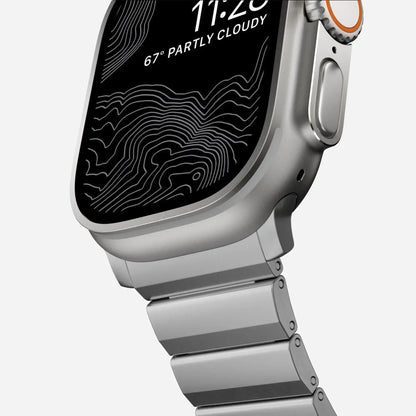Men's sleek titanium watch band with shiny finish, magnetic clasp, durable and lightweight; perfect for daily or formal wear.