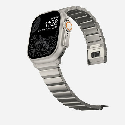 Men's sleek titanium watch band with shiny finish, magnetic clasp, durable and lightweight; perfect for daily or formal wear.