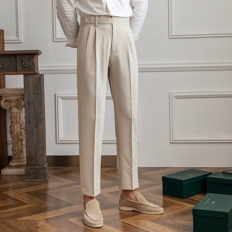 Men’s tailored essential trousers in classic colors, streamlined fit, perfect for formal or casual wear, showcasing elegance.