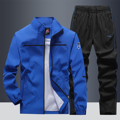 "Men's two-piece striped tracksuit with zip jacket and drawstring joggers, bold stripe design, comfortable fabric."