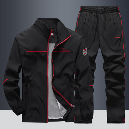 "Men's two-piece striped tracksuit with zip jacket and drawstring joggers, bold stripe design, comfortable fabric."