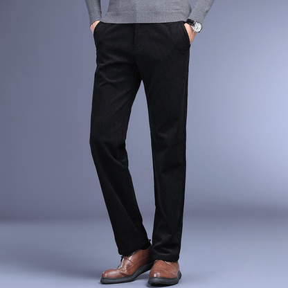 "Men's ultra-soft corduroy trousers with 4-way stretch, deep pockets, ideal for formal wear in black, brown, khaki, or navy."