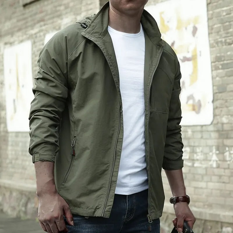 "Men's waterproof breathable cargo summer jacket with multiple pockets, perfect for outdoor adventures and summer showers."