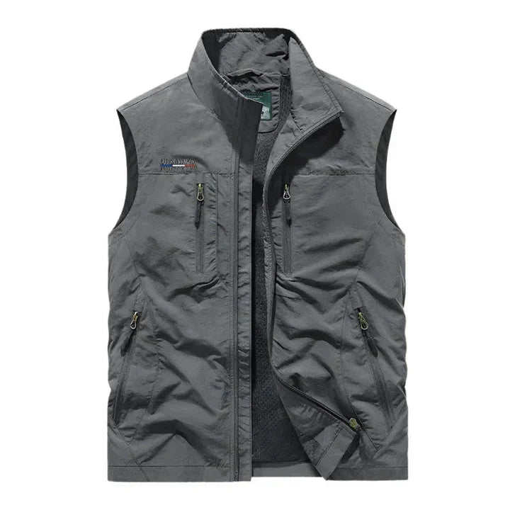 Men's waterproof insulated bodywarmer, sleek with multiple zip pockets; ideal for outdoor adventures in rain or chilly weathe