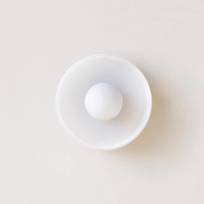 "Minimal flush mount ceiling light with frosted shade, sleek finish, offers soft illumination; ideal for modern and tradition