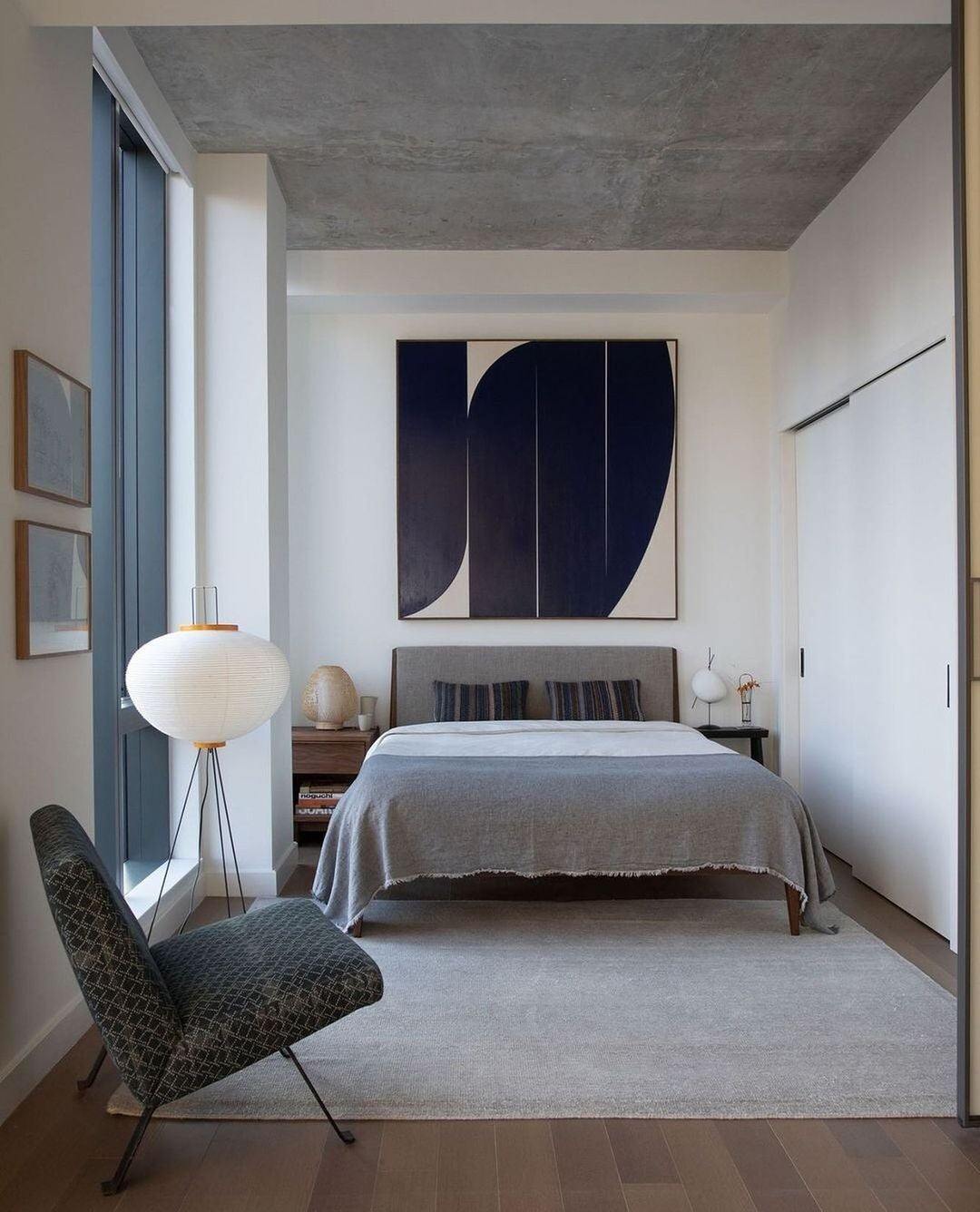 "Minimalist rice paper floor lamp with sleek metal frame and soft diffused light, perfect for creating a warm ambiance."