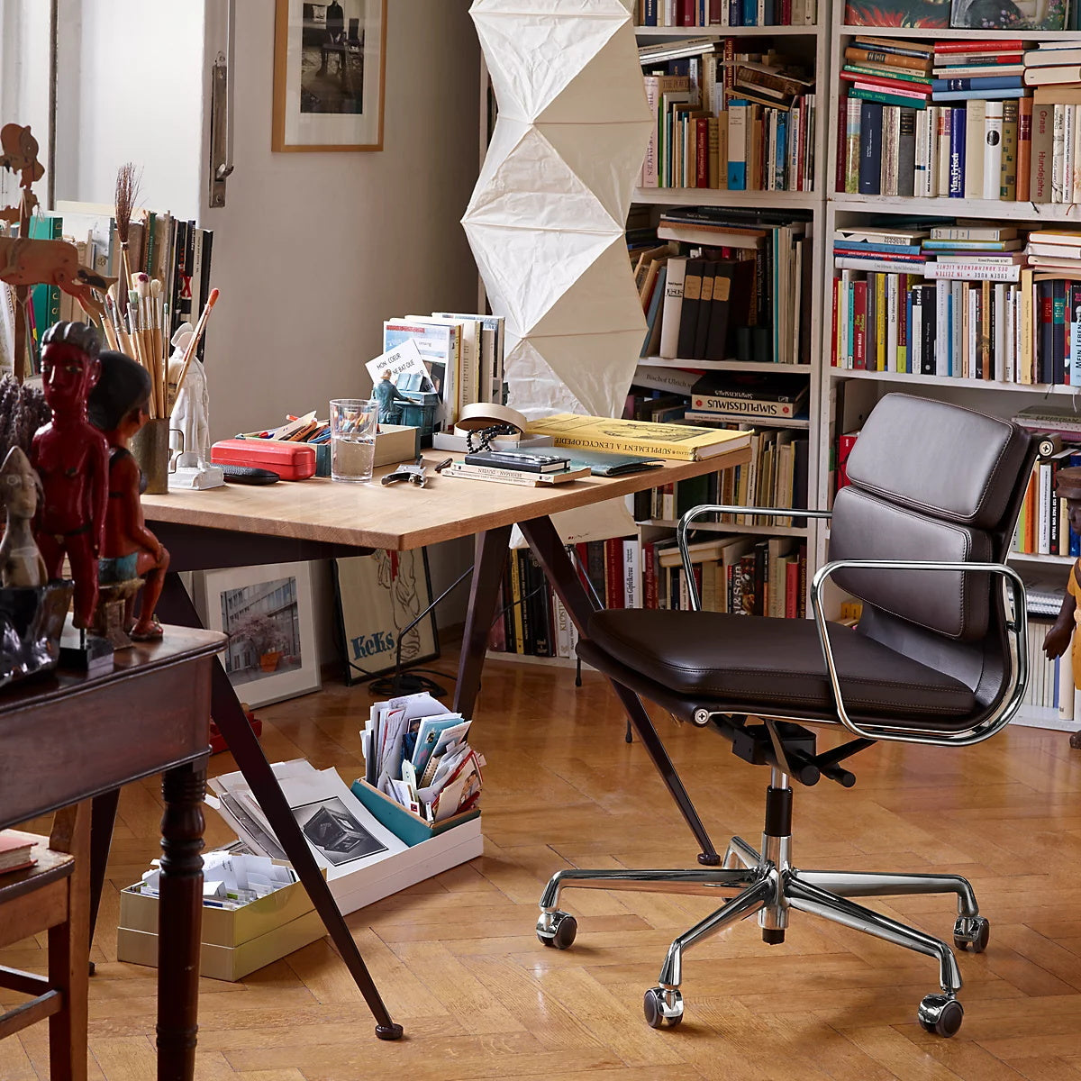 "Minimalist rice paper floor lamp with sleek metal frame and soft diffused light, perfect for creating a warm ambiance."