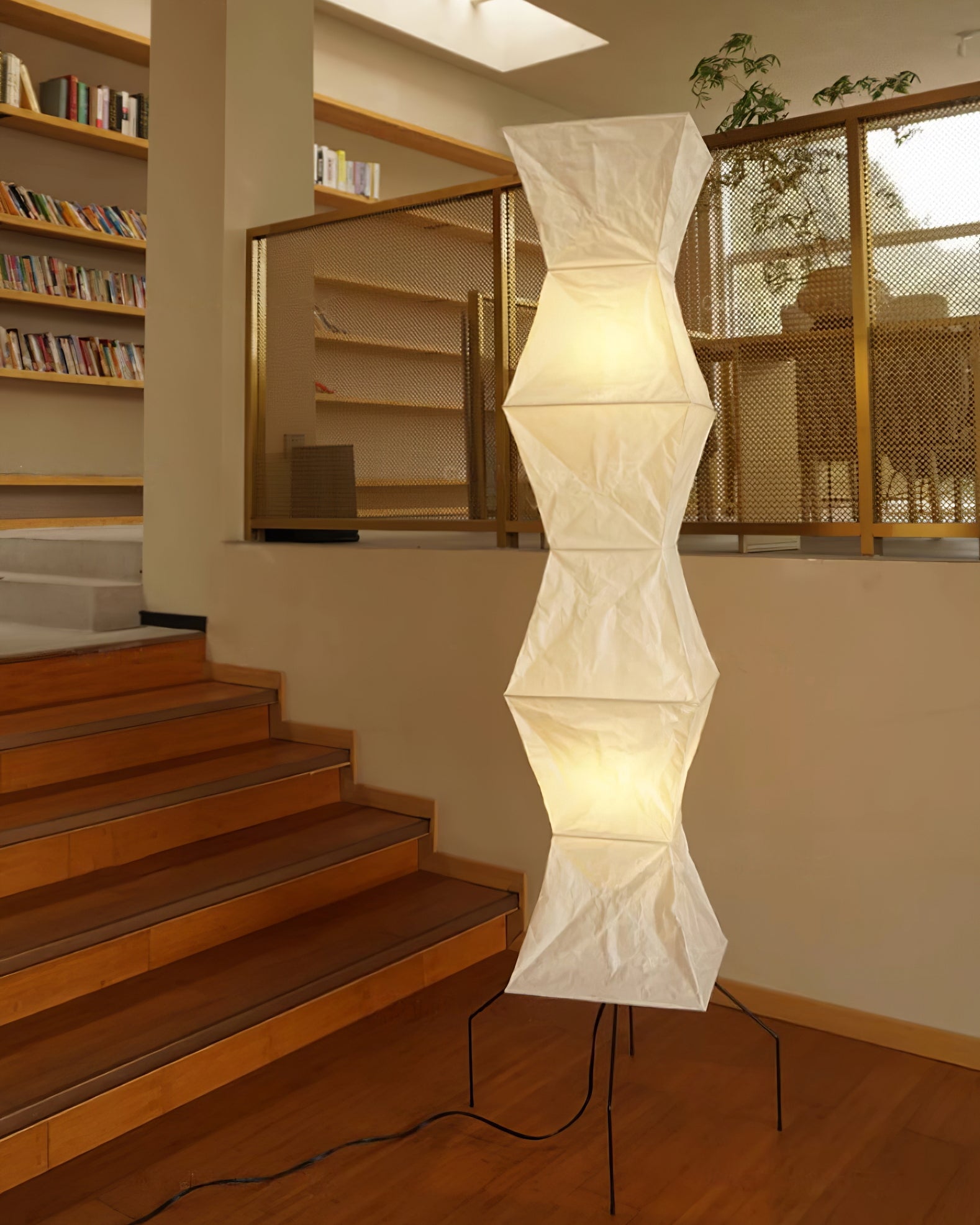 "Minimalist rice paper floor lamp with sleek metal frame and soft diffused light, perfect for creating a warm ambiance."