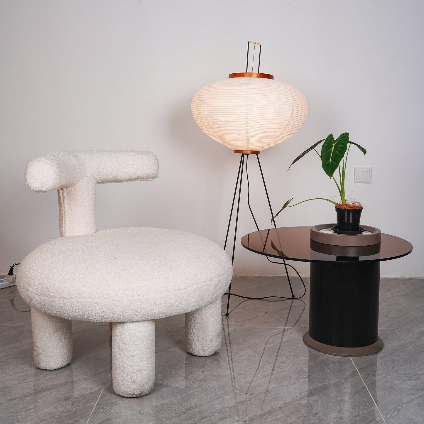 "Minimalist rice paper floor lamp with sleek metal frame and soft diffused light, perfect for creating a warm ambiance."