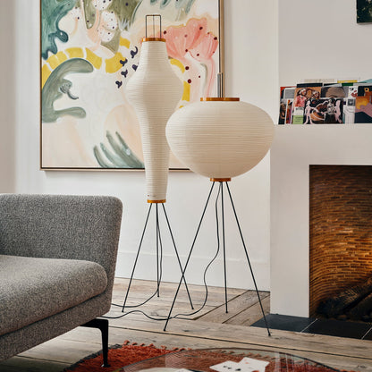 "Minimalist rice paper floor lamp with sleek metal frame and soft diffused light, perfect for creating a warm ambiance."