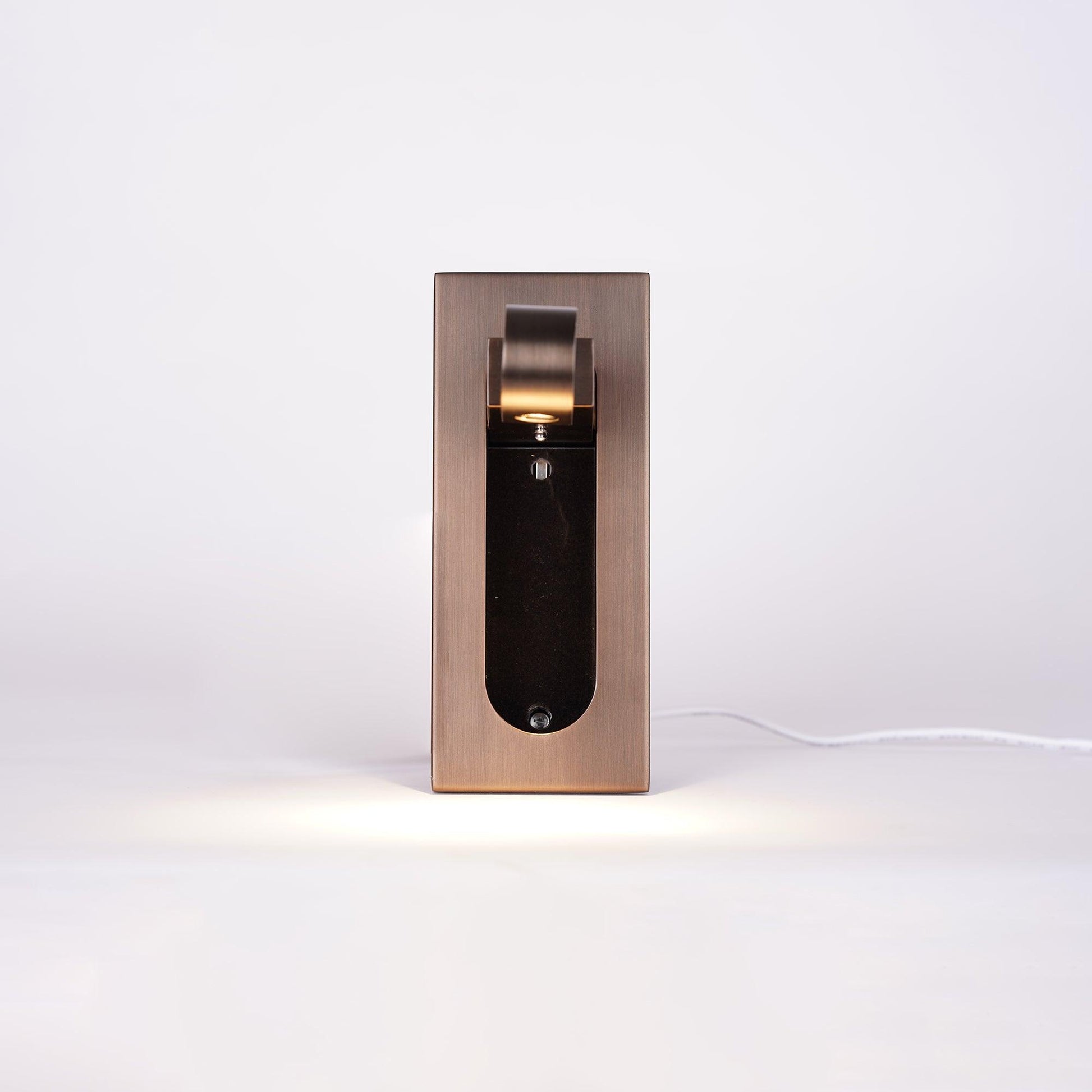 Modern adjustable LED bedside lamp in matte black with a sleek design, featuring an adjustable head for focused reading light