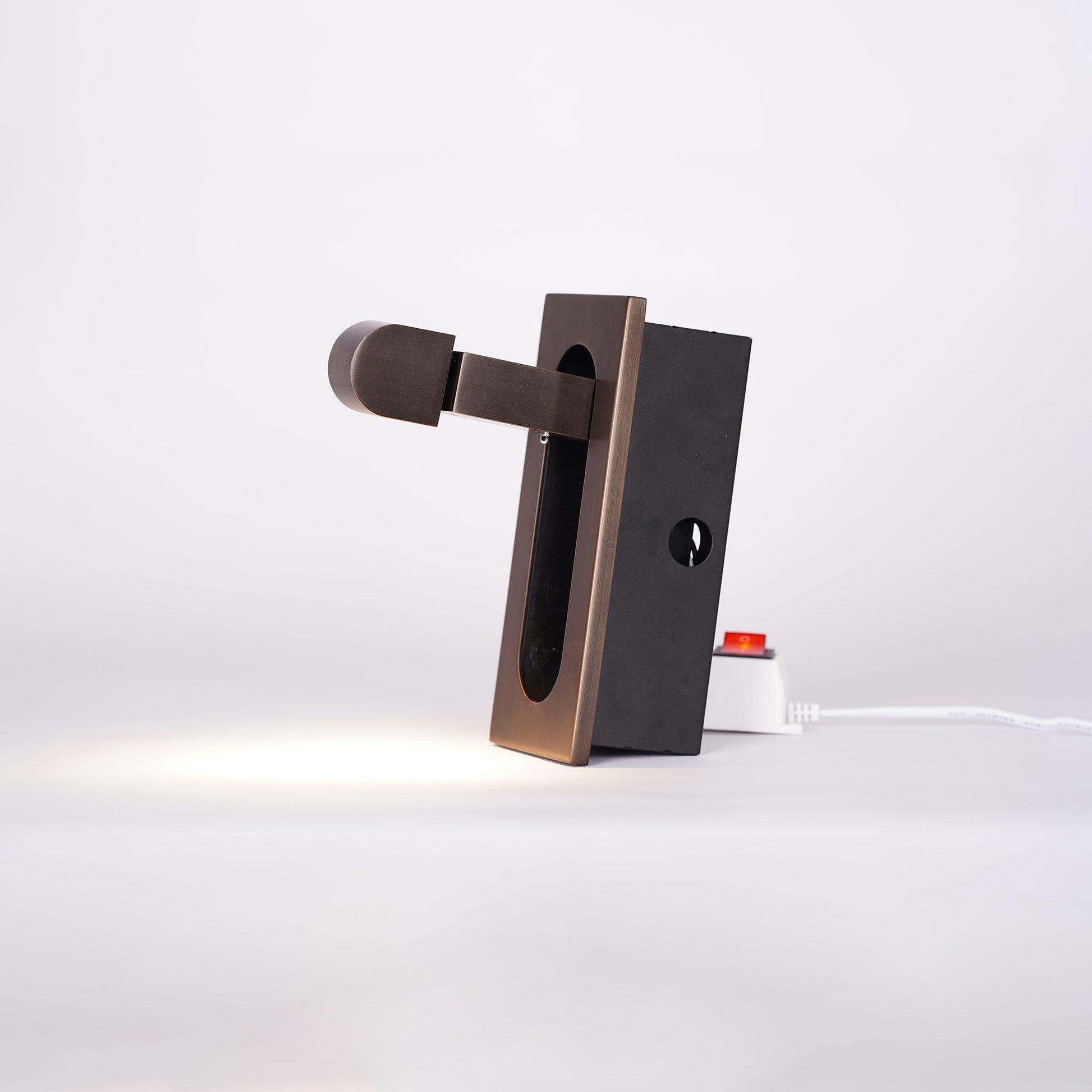 Modern adjustable LED bedside lamp in matte black with a sleek design, featuring an adjustable head for focused reading light