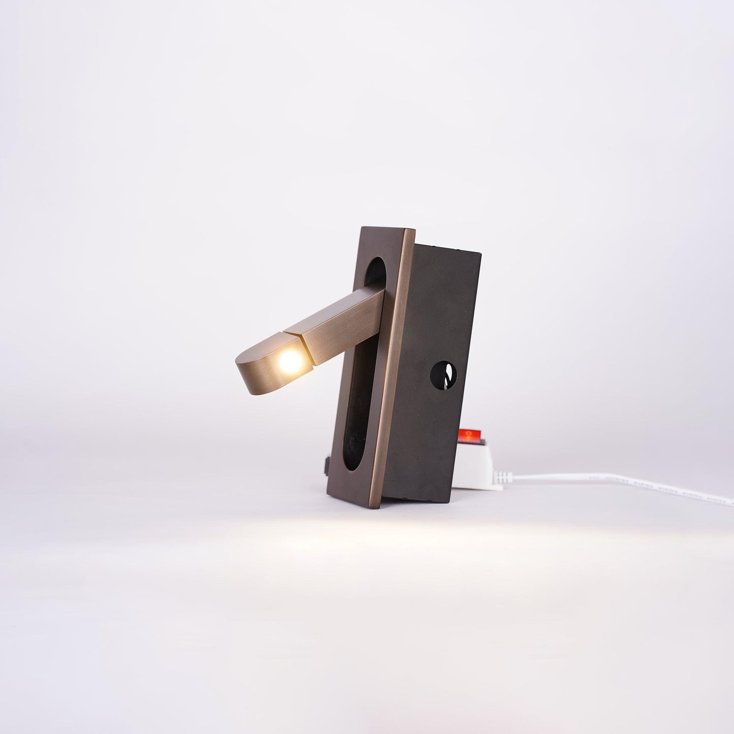 Modern adjustable LED bedside lamp in matte black with a sleek design, featuring an adjustable head for focused reading light