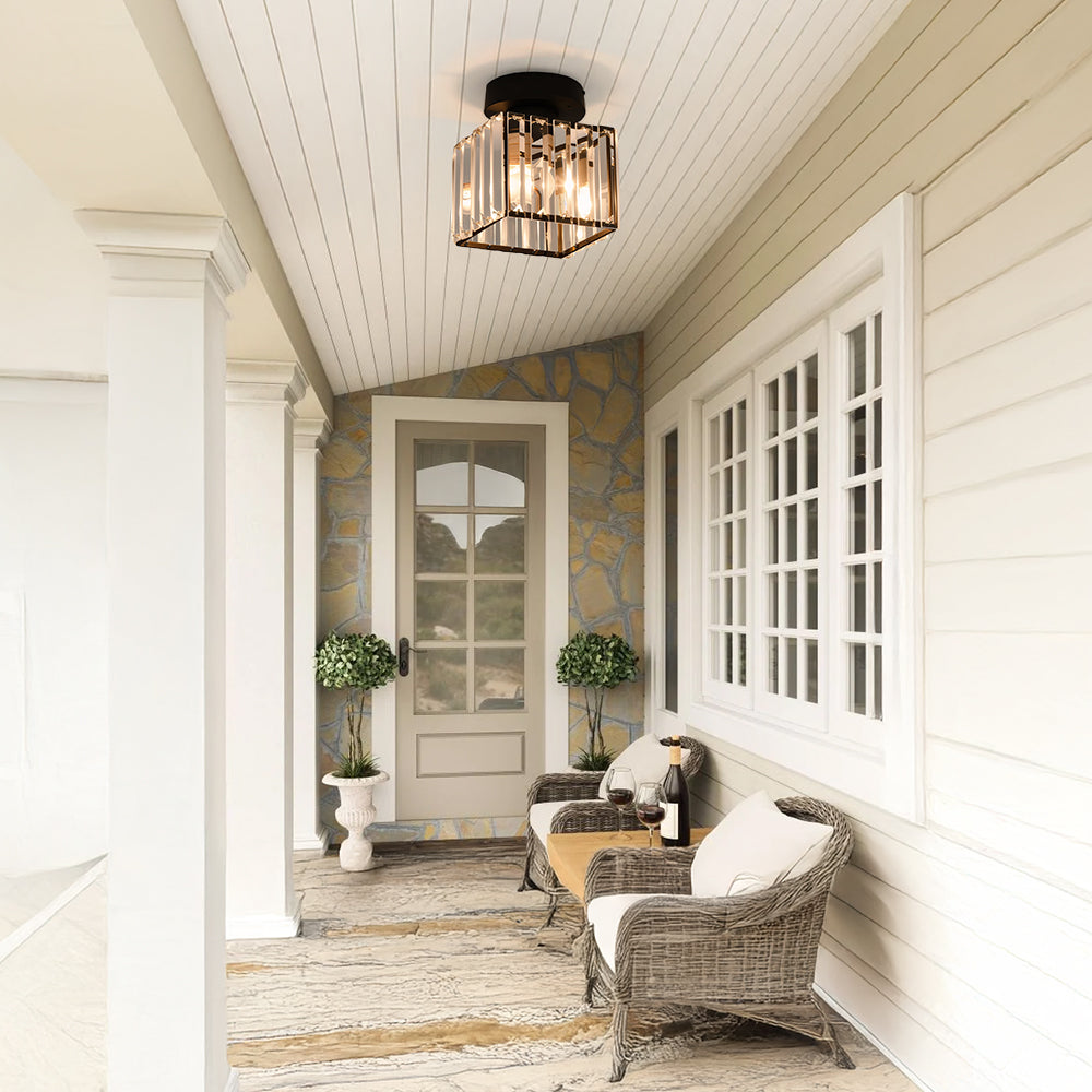 Modern black crystal flush mount ceiling light, sleek brass fixture, crystal shade, ideal for rooms with low ceilings.