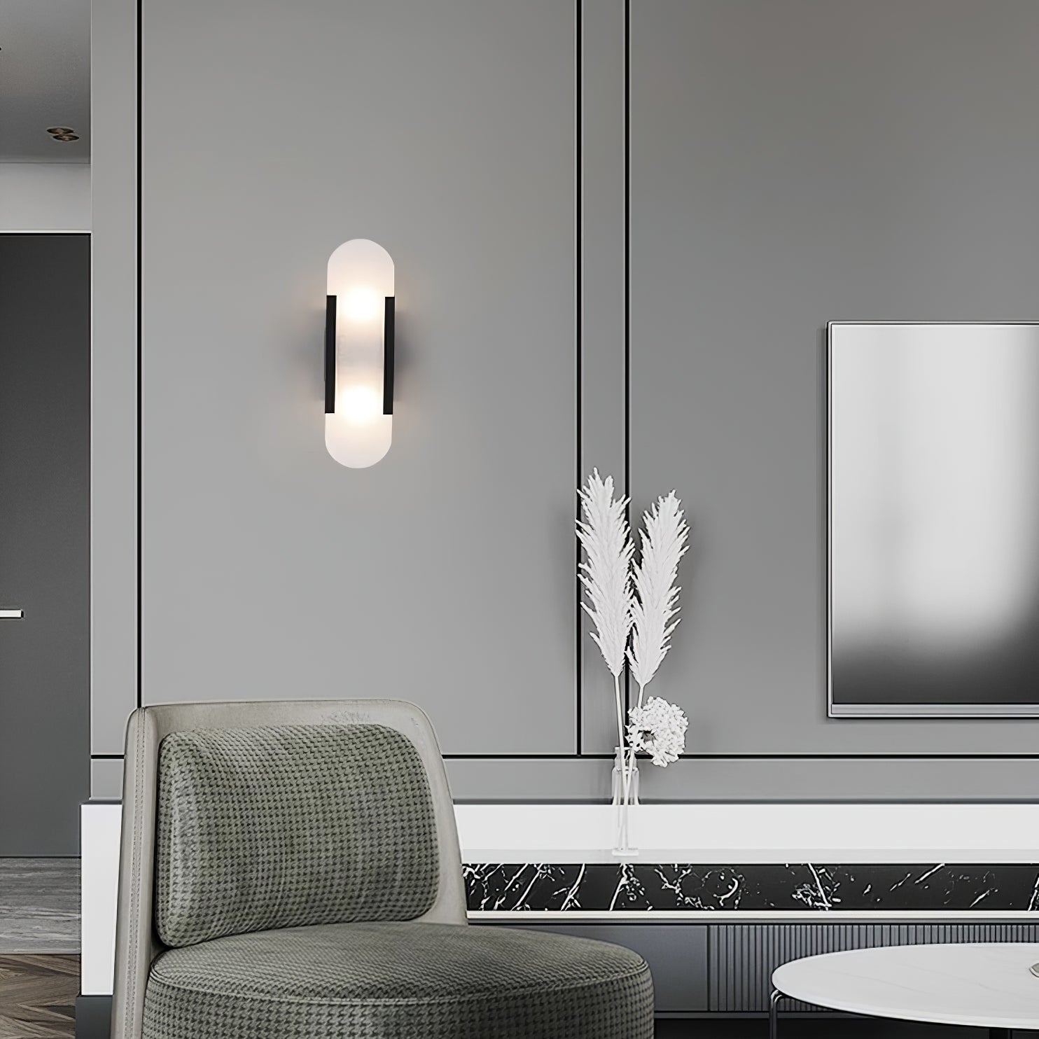 "Modern elongated alabaster wall lamp with metal and brass accents, emits warm glow, suitable for chic interior decor."