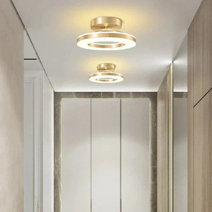 "Modern LED ceiling light with adjustable colors, sleek design, gold and black finish, perfect for contemporary interiors."