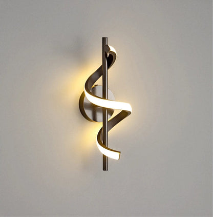 Modern LED wall sconce with adjustable gold arm and copper finish, ideal for ambient lighting in living rooms and bedrooms.