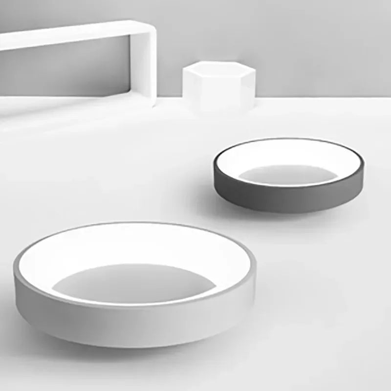 "Modern Nordic LED ceiling light with sleek round design in black, white, and gray for stylish minimalistic home decor."