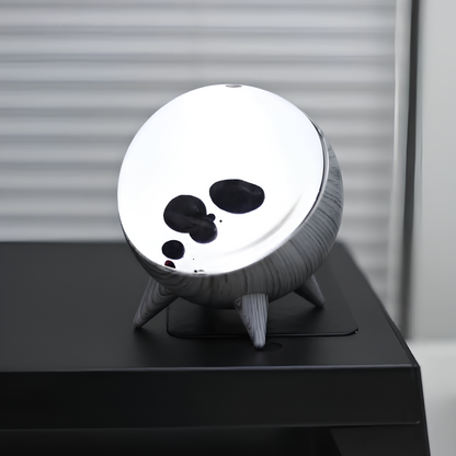 "Music-reactive ferrofluid display with black fluid art in motion, Bluetooth connectivity, and built-in lighting for tech lov