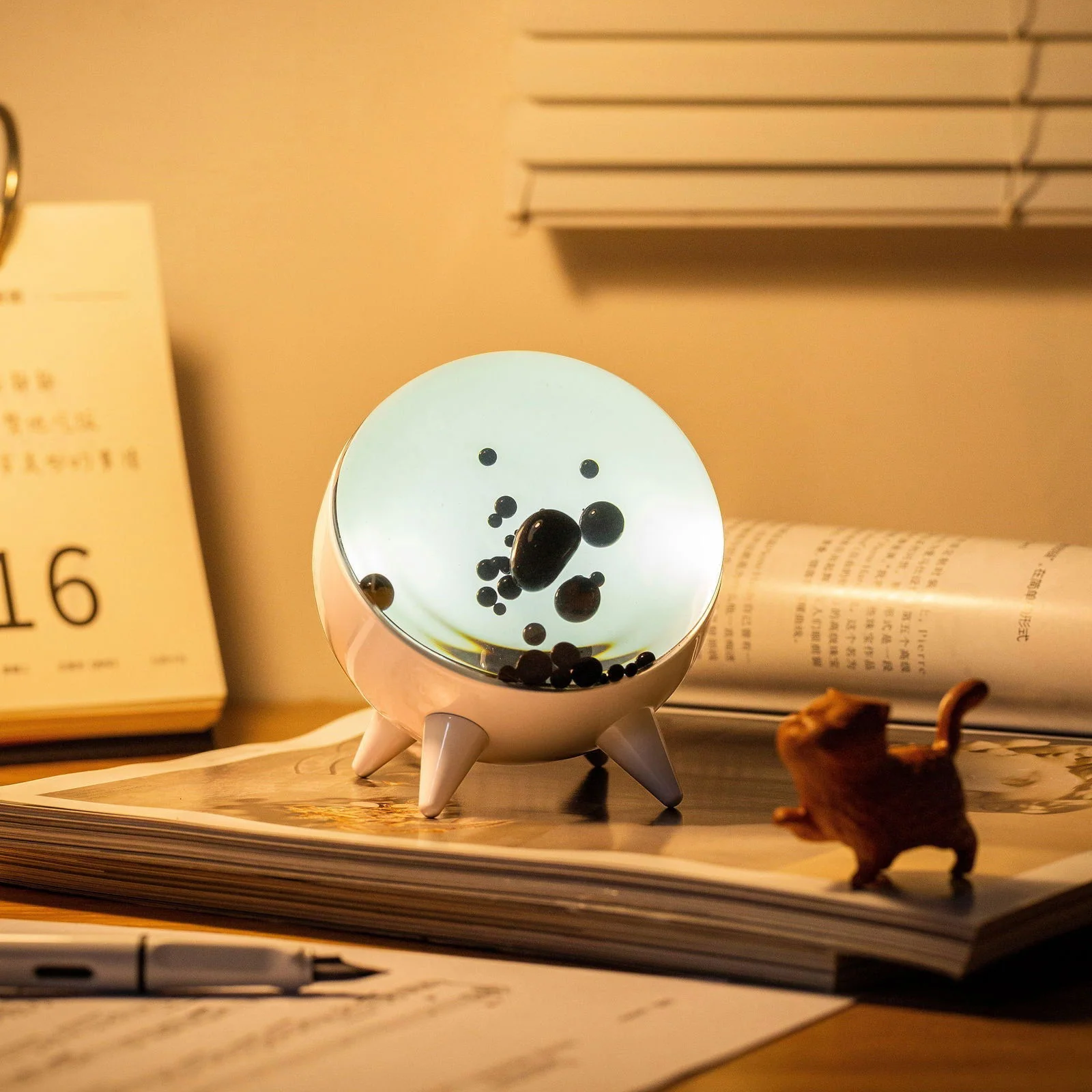 "Music-reactive ferrofluid display with black fluid art in motion, Bluetooth connectivity, and built-in lighting for tech lov