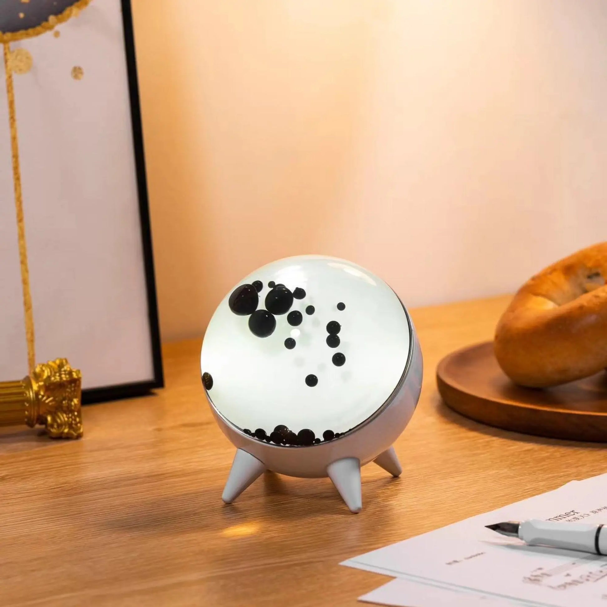 "Music-reactive ferrofluid display with black fluid art in motion, Bluetooth connectivity, and built-in lighting for tech lov