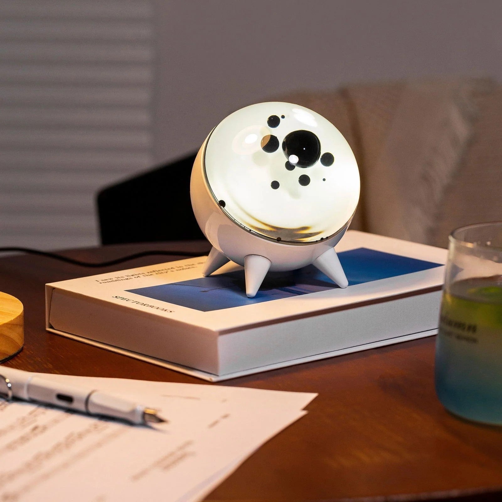 "Music-reactive ferrofluid display with black fluid art in motion, Bluetooth connectivity, and built-in lighting for tech lov
